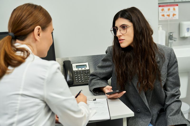 woman meeting with someone in lab coat 800
